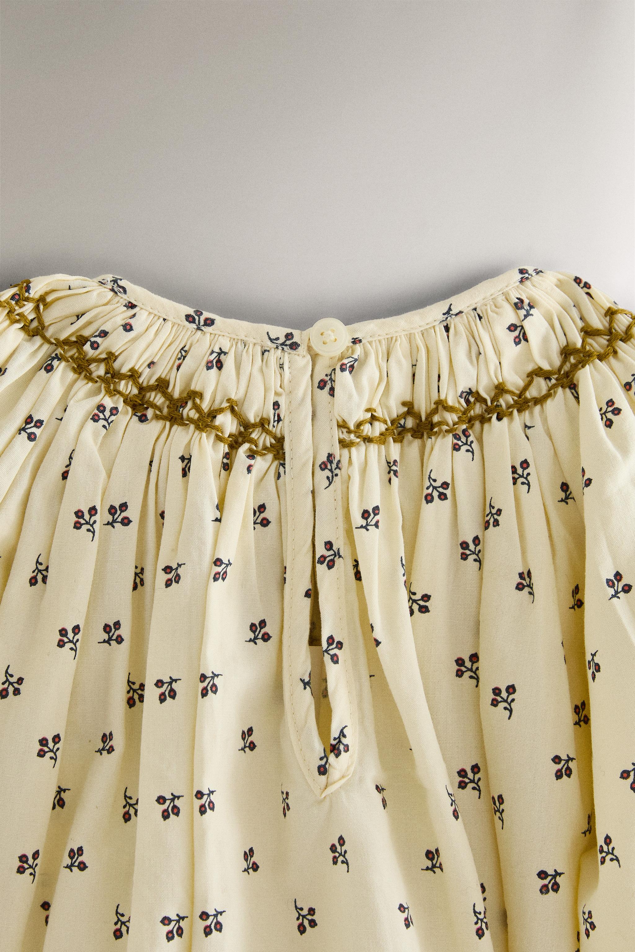 GATHERED FLORAL BABY ROMPER